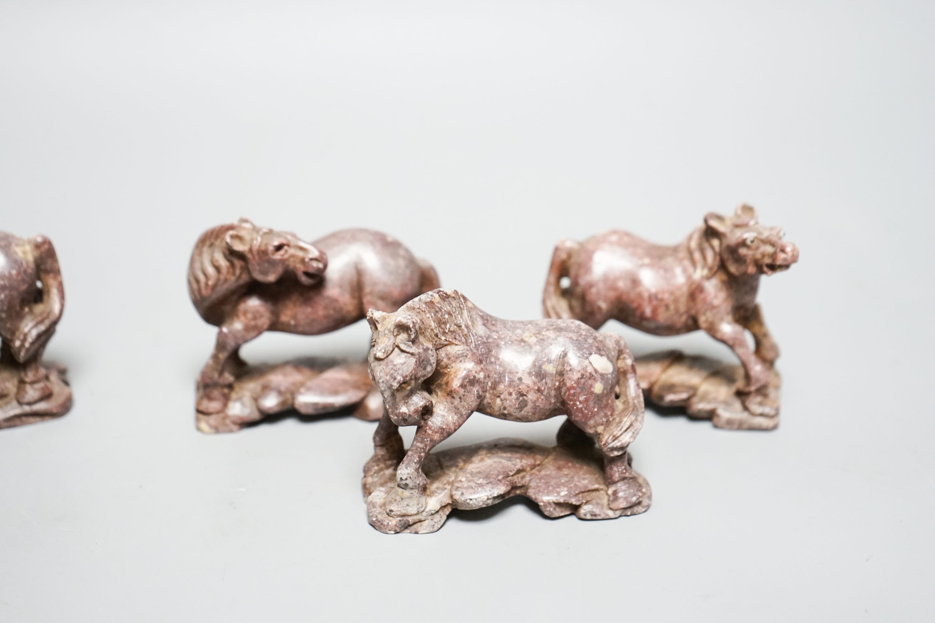 Six Chinese soapstone models of horses and a similar monkey, early 20th century